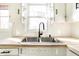 A stainless steel dual sink with a window view and wood countertops at 14 N Edmondson Ave, Indianapolis, IN 46219