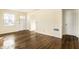 Comfortable living room featuring hardwood floors and neutral colored walls at 14 N Edmondson Ave, Indianapolis, IN 46219