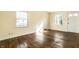 A sun-lit living room featuring attractive hardwood floors and neutral walls at 14 N Edmondson Ave, Indianapolis, IN 46219