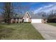 Charming brick home featuring a two-car garage and well-manicured front yard at 154 Dover N Blvd, Brownsburg, IN 46112