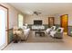 Living room featuring a ceiling fan, comfortable furniture and a mounted tv at 154 Dover N Blvd, Brownsburg, IN 46112