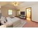 Main bedroom with ensuite bathroom, TV, and a large window at 154 Dover N Blvd, Brownsburg, IN 46112
