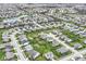 Picturesque aerial view of a neighborhood with well-maintained lawns, a tranquil pond, and tree-lined streets at 16753 Workington Way, Westfield, IN 46074