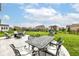 Beautiful backyard with patio, seating, and playground at 16753 Workington Way, Westfield, IN 46074