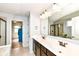 Modern bathroom with double sinks, a large mirror, and a walk-in glass shower at 16753 Workington Way, Westfield, IN 46074