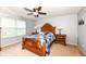 Comfortable bedroom featuring a ceiling fan, lamps, and an eye-catching quilt on the bed at 16753 Workington Way, Westfield, IN 46074