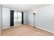 Neutral bedroom with a window, floor lamp, and light gray walls at 16753 Workington Way, Westfield, IN 46074