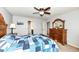 Bright bedroom showcasing a ceiling fan, stylish wooden dresser, and decor throughout at 16753 Workington Way, Westfield, IN 46074