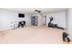 Large bonus room featuring a TV, ceiling fan, and exercise equipment at 16753 Workington Way, Westfield, IN 46074