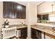 Practical home office area with granite countertops and matching dark cabinetry at 16753 Workington Way, Westfield, IN 46074