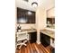 Efficient home office area with granite countertops and ample storage in dark cabinetry at 16753 Workington Way, Westfield, IN 46074