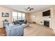 Spacious living room featuring carpet, fireplace, TV, and lots of natural light at 16753 Workington Way, Westfield, IN 46074