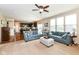 Open-concept living area featuring hardwood floors, carpet, comfortable seating, and natural light at 16753 Workington Way, Westfield, IN 46074