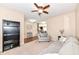 Bright living room featuring neutral carpet, ceiling fan, comfortable seating, and natural light at 16753 Workington Way, Westfield, IN 46074