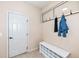 Functional mud room with coat hooks, a bench, and shoe storage by the entrance at 16753 Workington Way, Westfield, IN 46074