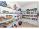 Walk-in pantry with ample shelving and storage for groceries and household items at 16753 Workington Way, Westfield, IN 46074