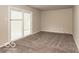 Neutral bedroom with a sliding glass door to the outside at 1707 N Leland Ave, Indianapolis, IN 46218