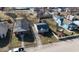 Aerial view of the home, surrounded by mature trees and a well maintained lawn on a clear, sunny day at 1830 N Livingston Ave, Indianapolis, IN 46222