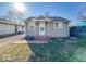 Charming single story home featuring brick steps, neutral siding, and a well-maintained lawn on a sunny day at 1830 N Livingston Ave, Indianapolis, IN 46222