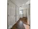 This long hallway has wood-look floors and includes laundry units at the end at 1830 N Livingston Ave, Indianapolis, IN 46222