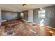 View of the living room featuring hardwood floors, and light from windows and overhead lighting at 1830 N Livingston Ave, Indianapolis, IN 46222