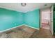 Aqua room showcases the potential to create a unique and functional space, ready for upgrades at 1830 N Livingston Ave, Indianapolis, IN 46222