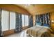 A vaulted wood ceiling and generous natural light makes this main bedroom feel cozy at 1849 E Thompson Rd, Indianapolis, IN 46227