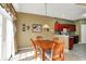 Cozy dining room with wood table set and decorative mirror at 2255 Colfax Ln, Indianapolis, IN 46260