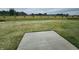 Wide-open backyard space perfect for relaxation with grass and the concrete slab for entertaining at 2290 Oakmont Dr, Plainfield, IN 46168