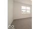 Bedroom with carpet and natural light from the window at 2290 Oakmont Dr, Plainfield, IN 46168