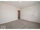 A bedroom has neutral walls and carpet and a double-door closet at 2290 Oakmont Dr, Plainfield, IN 46168