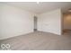 Spacious bedroom with a double door closet and a doorway that leads to a bathroom at 2290 Oakmont Dr, Plainfield, IN 46168