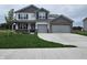 Charming two-story home with a two-car garage, manicured lawn, and a welcoming front entrance at 2290 Oakmont Dr, Plainfield, IN 46168