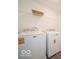A laundry room features a side-by-side washing machine and dryer, and wire shelving at 2290 Oakmont Dr, Plainfield, IN 46168