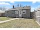 Exterior shot showcasing the home's backyard, and grey siding at 2315 Caldwell Pl, Columbus, IN 47201