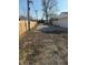 View of the backyard and gravel driveway that leads to the garage at 2315 Caldwell Pl, Columbus, IN 47201
