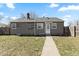 Exterior shot showcasing the home's backyard, and grey siding at 2315 Caldwell Pl, Columbus, IN 47201