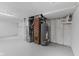 Basement featuring painted walls and floor, along with modern water heater and mechanicals at 2315 Caldwell Pl, Columbus, IN 47201