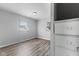Bedroom with neutral gray paint, wood-look floors and closet with drawers at 2315 Caldwell Pl, Columbus, IN 47201