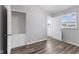 Bright bedroom featuring a closet, neutral paint, wood-look flooring, and natural light at 2315 Caldwell Pl, Columbus, IN 47201