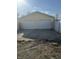 Exterior of a two-door garage with light yellow siding and a concrete driveway on a sunny day at 2315 Caldwell Pl, Columbus, IN 47201