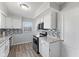 Bright kitchen featuring white cabinets, stainless steel appliances, and modern backsplash at 2315 Caldwell Pl, Columbus, IN 47201