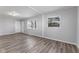 Living room with wood-look floors, neutral paint, and plenty of natural light at 2315 Caldwell Pl, Columbus, IN 47201