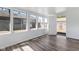 Bright sunroom featuring hardwood floors and a view of the backyard at 2315 Caldwell Pl, Columbus, IN 47201