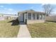Enclosed sunroom with large windows provides ample natural light and a cozy space at 2315 Caldwell Pl, Columbus, IN 47201