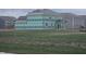 New construction home with a green-covered exterior, set on a lot with freshly laid sod at 2340 Pine Valley Dr, Plainfield, IN 46168