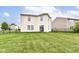 Spacious backyard with a lush green lawn and a black chain-link fence at 2992 Sentiment Ln, Greenwood, IN 46143