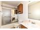 Bathroom with a shower tub, oak cabinets, and a large mirror at 2992 Sentiment Ln, Greenwood, IN 46143