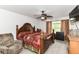 Cozy bedroom with a beautiful wooden bed frame and a ceiling fan at 2992 Sentiment Ln, Greenwood, IN 46143