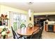 Bright dining area with light yellow walls, wood table, and natural light streaming in at 2992 Sentiment Ln, Greenwood, IN 46143